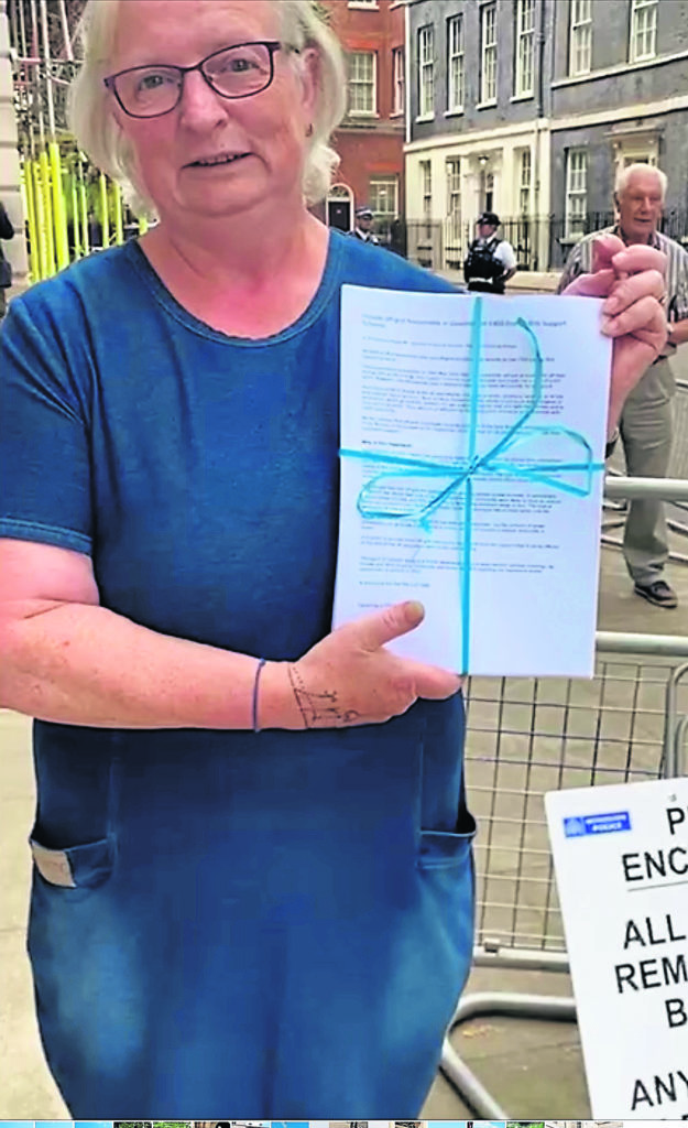 Kim Marshall with the petition launched by the National Bargee Travellers Association (NBTA). 