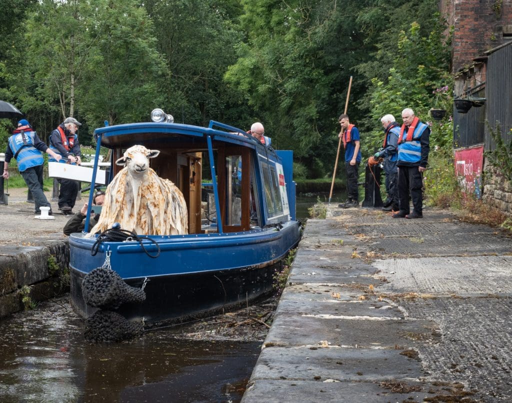 Shuttling sheep:- Pethera aboard the e-Shuttle. Photo credit: Alan Stopher, chair of Huddersfield Canal Society.