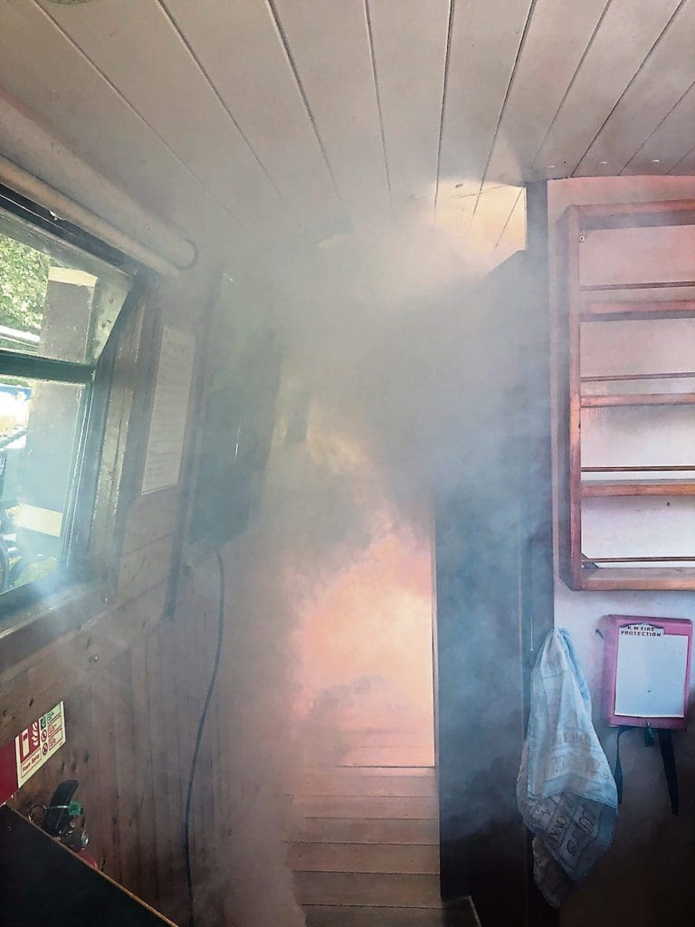 Setting the scene – artificial smoke is pumped into the canalboat, Lady Rhodes, one of the fleet owned by the charity, Safe Anchor Trust.