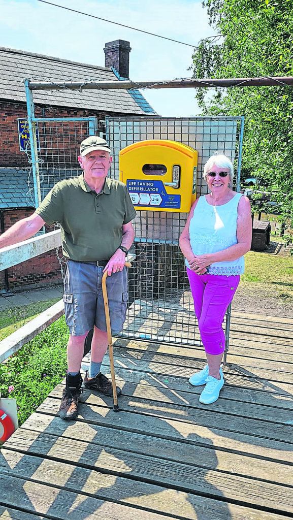 Mike McDonald ex-commodore, with current Lichfield Cruising Club commodore Joan Surplice and the defibrillator. PHOTO: RAY HARTSHORNE