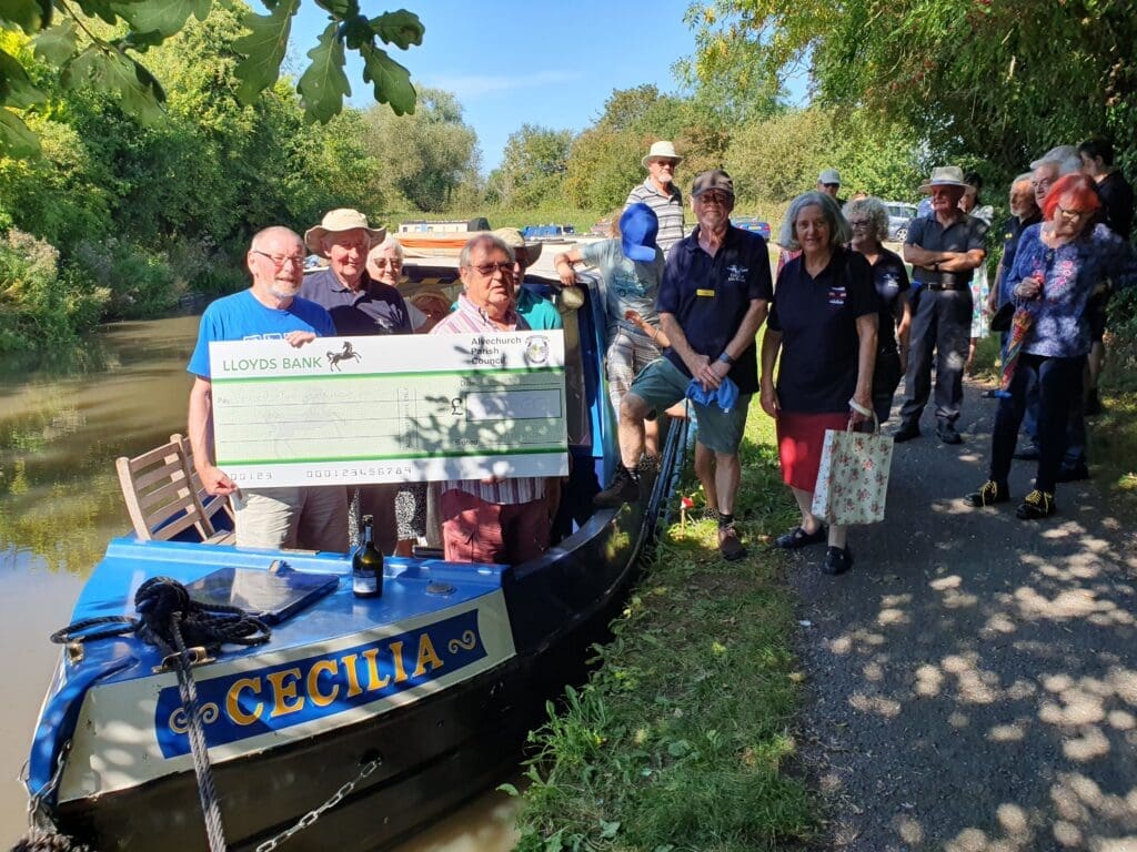 Leader of Alvechurch Parish Council (APC), Cllr. Marc Worrall, presents Worcester-Birmingham & Droitwich Canals Society Chair, David Wheeler, with a cheque for £500 towards the upkeep of our community narrowboat 'Cecilia'.