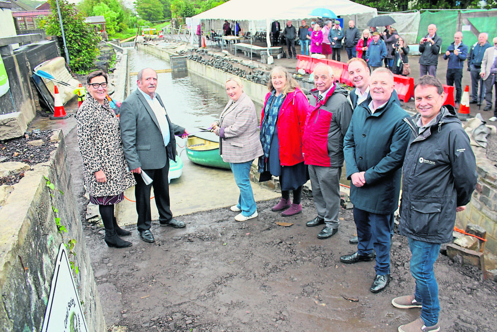 Rebecca Evans, MS (Member of Senedd) for Gower, third from left, cuts the ribbon watched by, from left: Tonia Antoniazzi, Gower MP; Coun Gordon Walker, Swansea Canal Society chairman; Julie James, MS for Swansea West; Mike Hedges, MS for Swansea East; Coun Rob Stewart, Swansea Council leader; Jeremy Miles, MS for Neath and Mark Evans, Glandwr Cymru Wales & South West director.