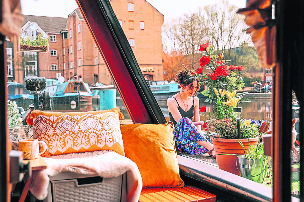 Colicia Summers relaxes on narrowboat Lazydays.