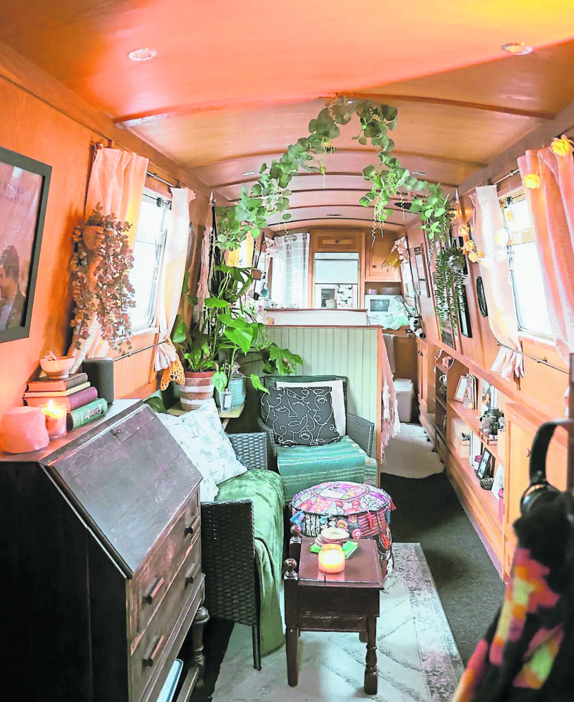 The cosy interior of her narrowboat.