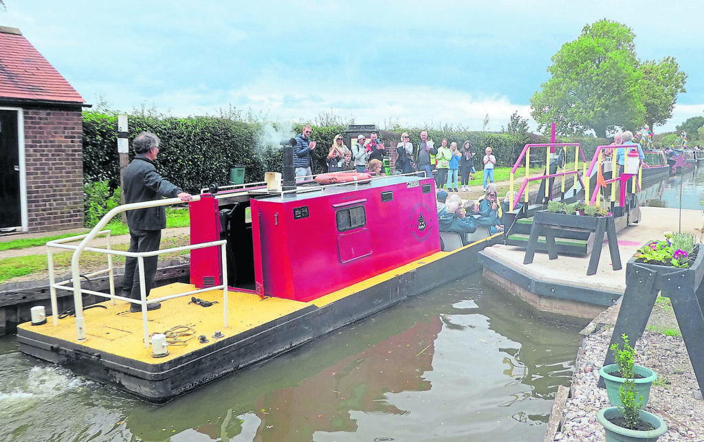 Workboat Ram takes passengers through the gate.