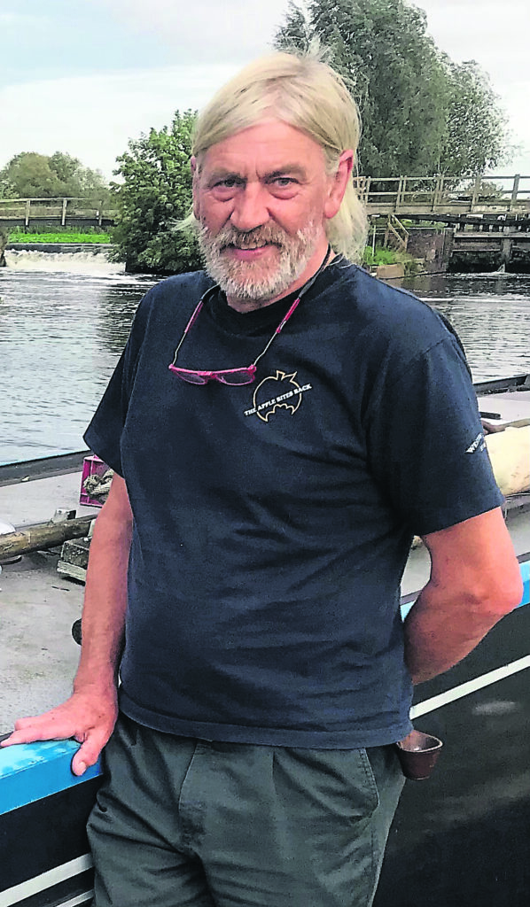 Pete Gammond by the side of his boat.