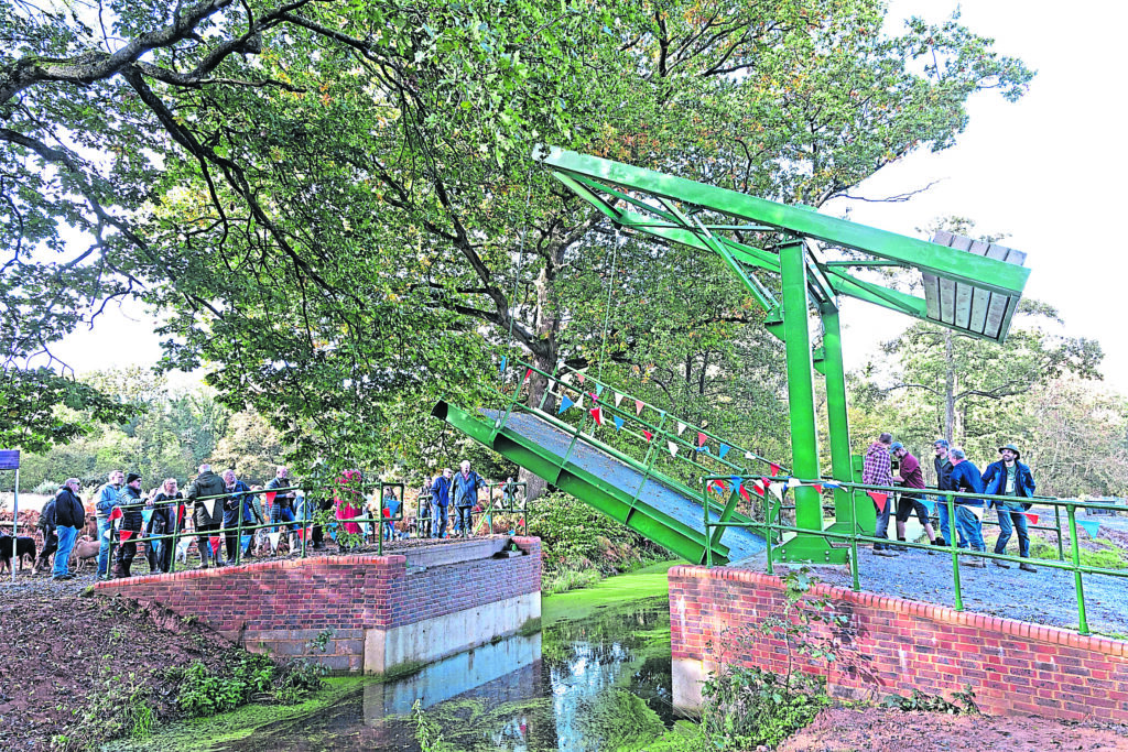 The first of the two lift bridges opened on the day is raised after the ceremony. PHOTO: WACT