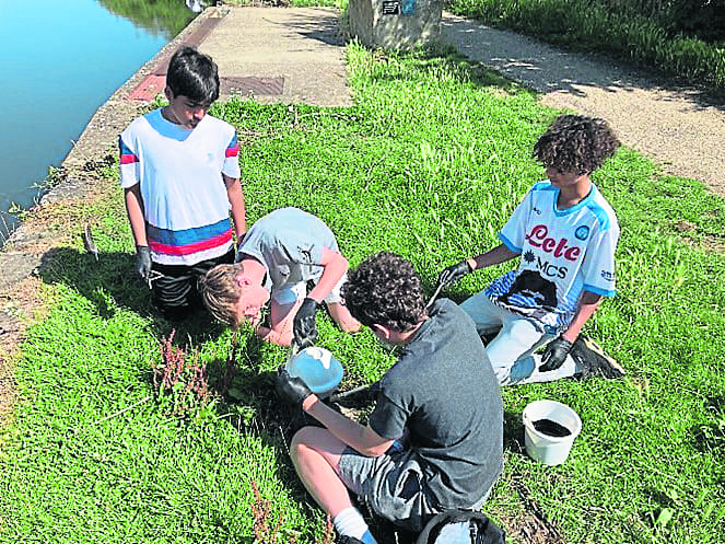 ON THE scorching-hot final day of the summer term 2023, 40 pupils from Berkhamsted Boys School in Hertfordshire set to work painting infrastructure along the Grand Union Canal, next to the school’s Castle Campus in the town. The day, organised through the Inland Waterways Association working in collaboration with the Canal & River Trust, formed part of the annual House Service Day, time set aside from normal lessons to make a difference for good in the local community.After a health and safety briefing led by Jack Prothero from CRT, the boys were introduced to the history of the Grand Union Canal and work of the CRT and IWA by Chiltern Branch member and geography teacher, Paul Greenhalgh. Under the supervision of school and CRT staff, the boys divided into small groups, before walking to five sites along a mile-long stretch of the nearby canal. In the space of just a few hours, the aesthetic of the towpath environment was transformed, as the boys demonstrated leadership and worked collaboratively to paint mooring bollards, railings and paddle gear. One Year 8, who worked on painting the Castle Street footbridge (141), commented on how satisfying it was to renew a piece of infrastructure used by hundreds of people in the school community and wider public each day. It is hoped the students’ efforts have been appreciated by waterways users throughout the summer season; they look forward to new projects to work on in the coming year!
