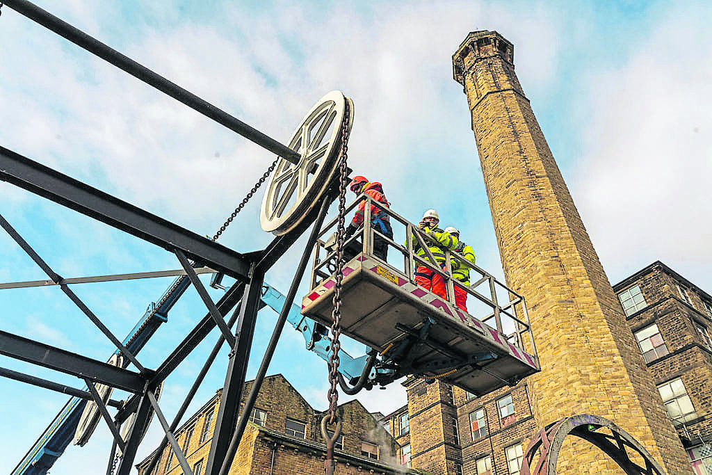 A cherry picker is used to reach the top of the 6m high bridge