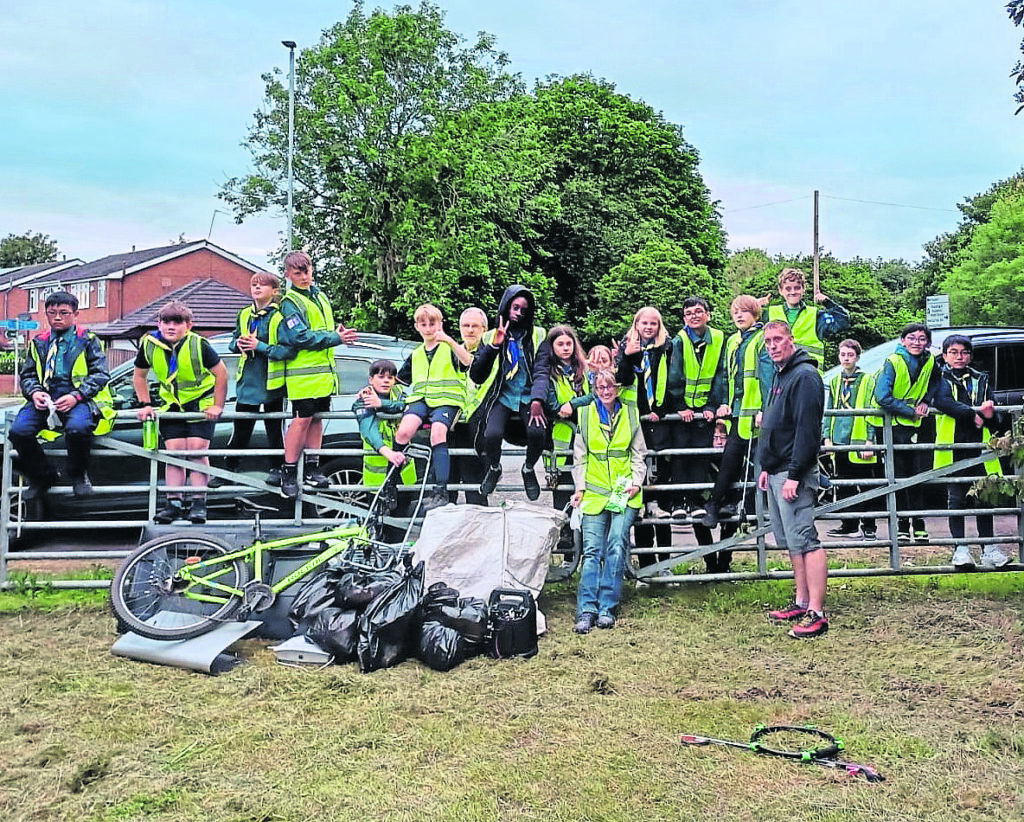 New Cut Heritage and Ecology Trail members and scouts show results of their clean-up at Woolston Park South. PHOTO: SUPPLIED