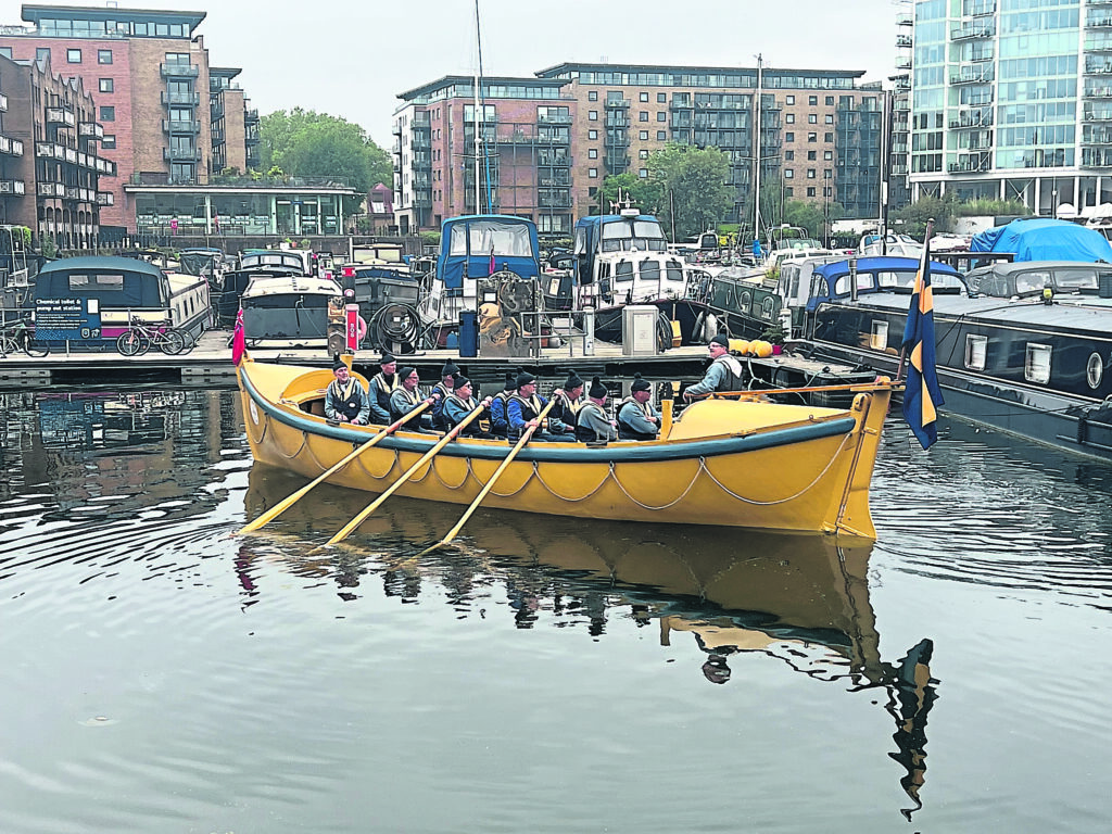 Lifeboat Lifbåt 416 is rowed into Limehouse Basin.