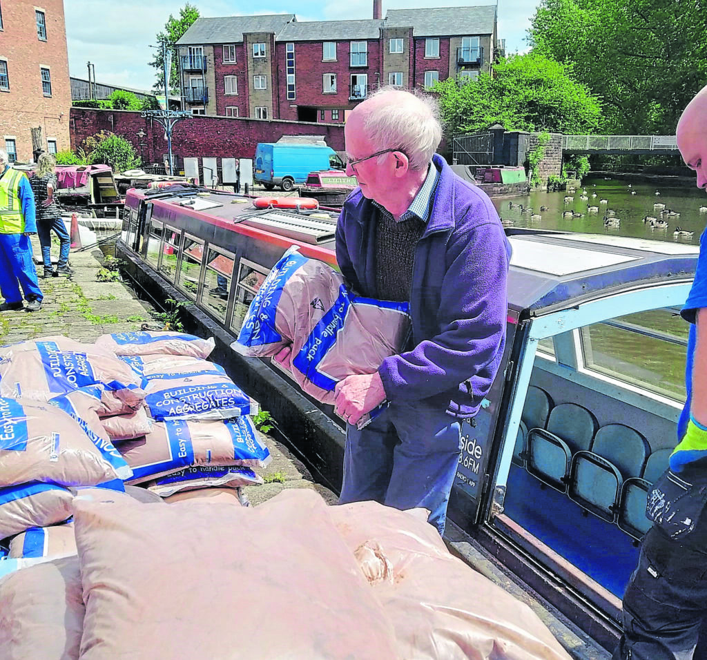 Volunteers helped load, distribute and unload 153 bags of sand, weighing 25kg each, for the heel test.