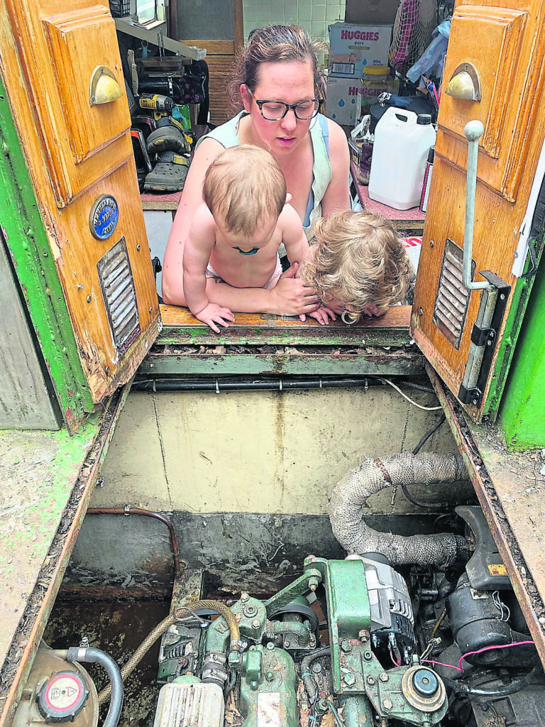 Mum, Dawn, surveys the engine with her young apprentices, Harley and Willow.