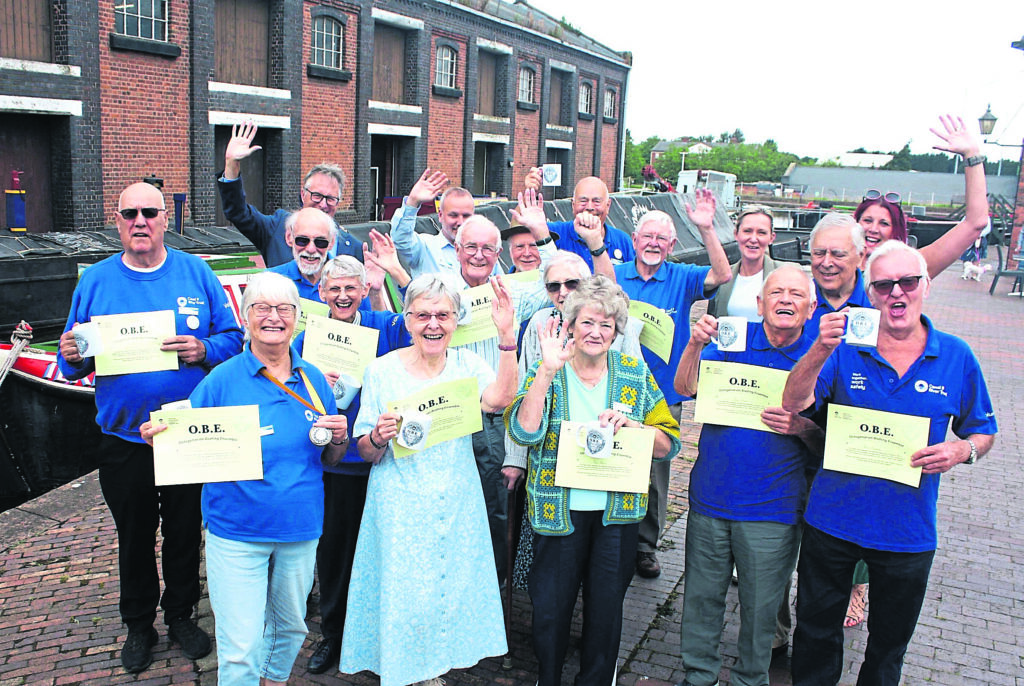 Volunteers celebrating their new ‘OBE’ with colleagues at the National Waterways Museum, Ellesmere Port. PHOTO: CRT