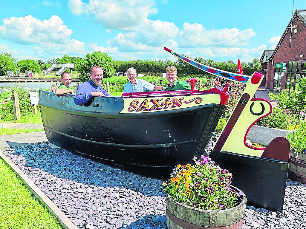 The Overwater Marina workshop team involved in the restoration with Nick Grundy, deputy chair of the Saturn Flyboat Restoration Committee. From left are Jonathan Nowell, Matthew Anderson, Nick Grundy and Owen Turner. PHOTO: Supplied