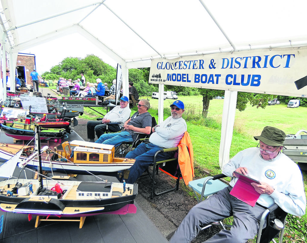 Members of Gloucester & District Model Boat Club with some of their models.