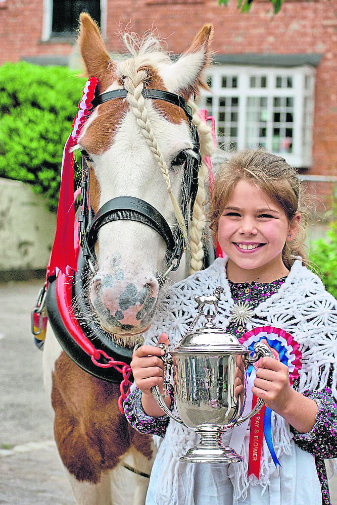 Elizabeth Ray and her horse Flower, with the Canal Boat Horse Class trophy. PHOTO: KEV MASLIN