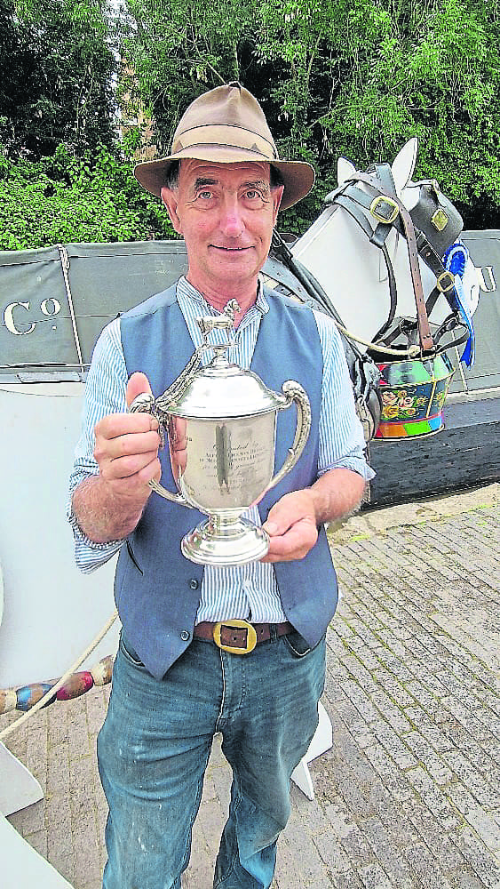 Staffordshire boat builder Roger Fuller with the Canal Boat Horse Class trophy, which he saved from being melted down and will once again be awarded to the best dressed horse on the canals. PHOTO: KEV MASLIN