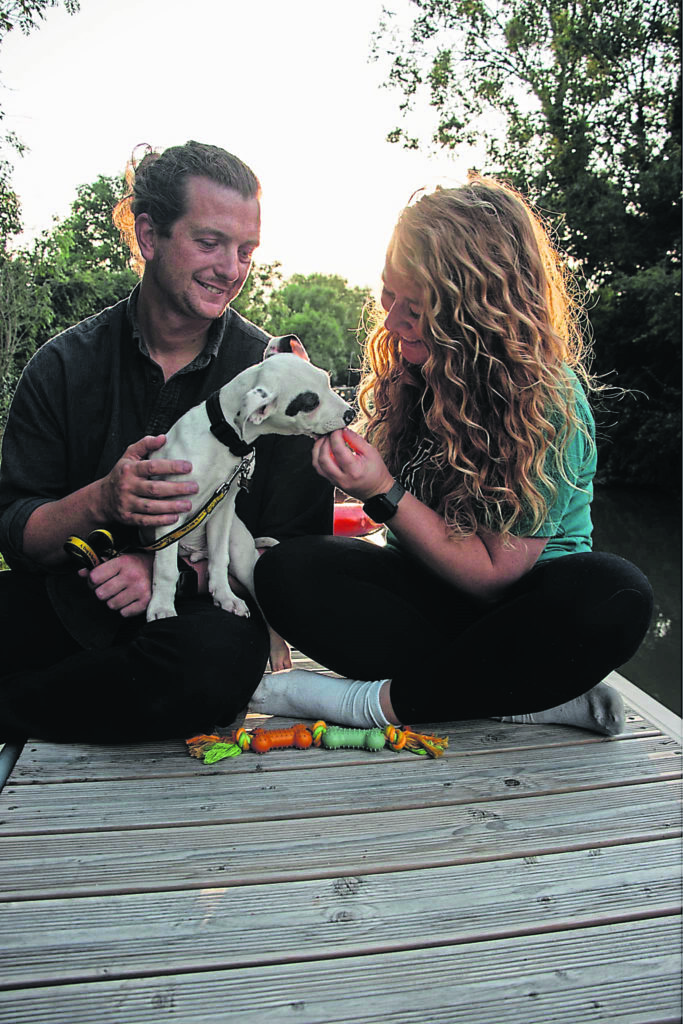 Abbie Jade and her partner Josh with their newly adopted Staffordshire-cross puppy, Sydney. They adopted Sydney from Dogs Trust after struggling to find a rescue centre that would let them rehome a dog. PHOTO SUPPLIED