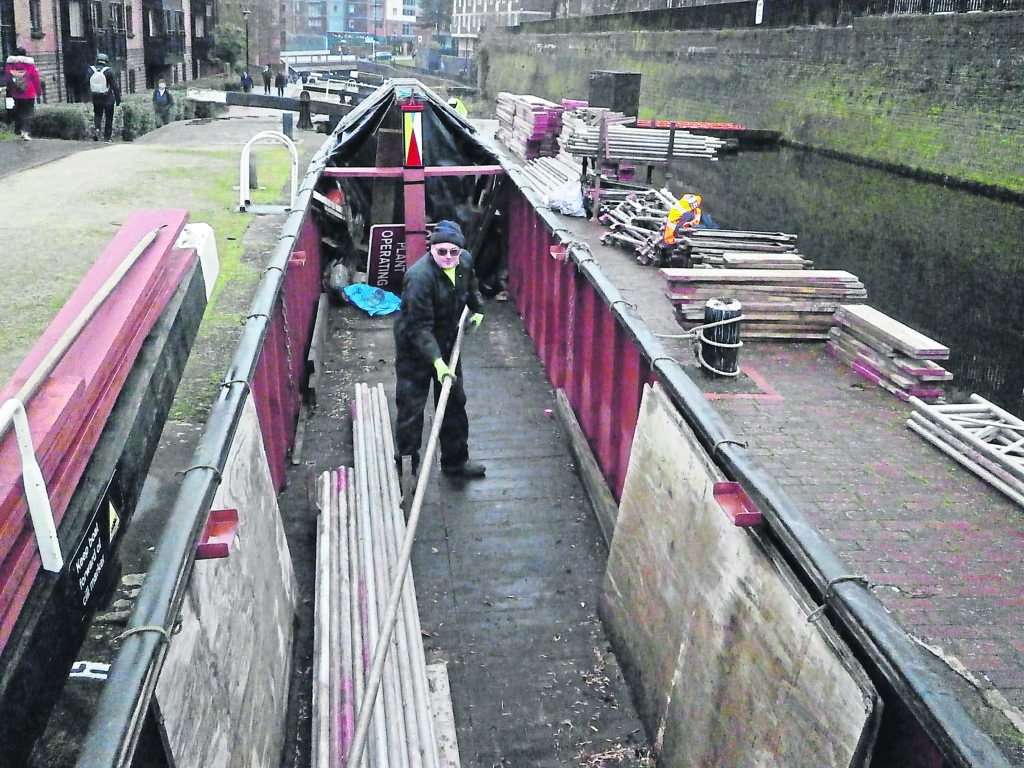 Scaffolding being unloaded at the CRT yard, Icknield Port Loop. The vessel nb Arundel is owned by CBOA secretary Richard Horne. PHOTO: RICHARD HORNE