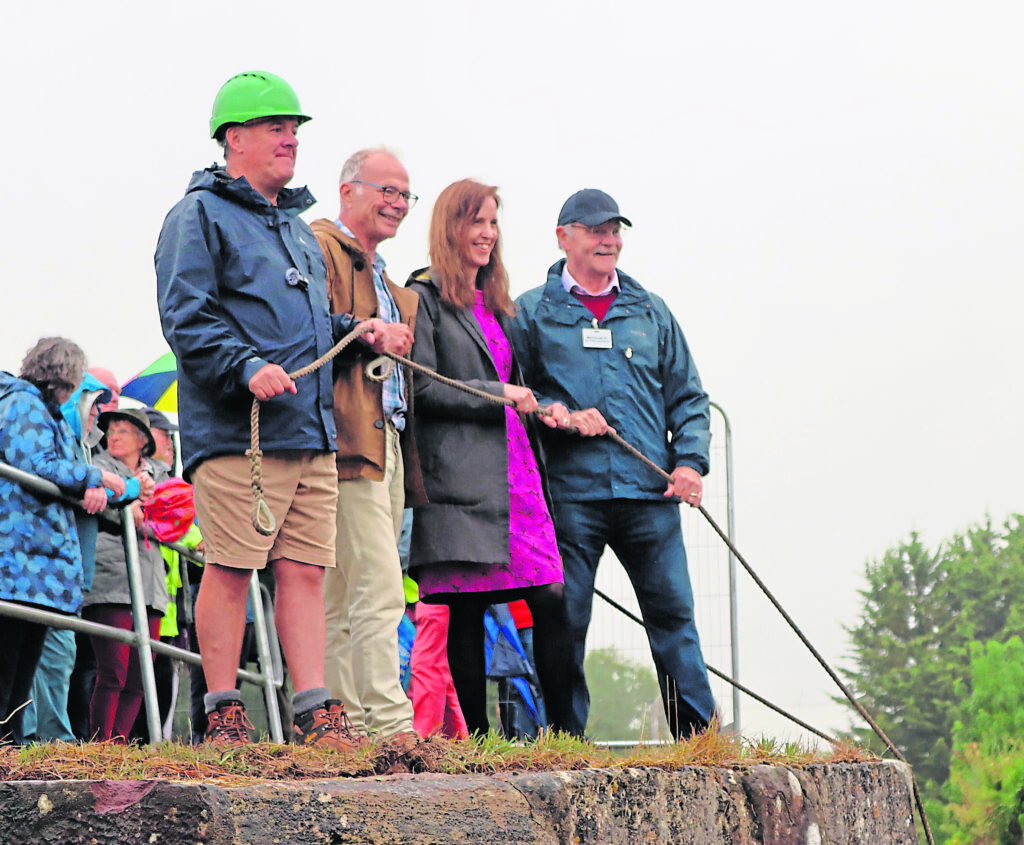 From left at Dock Lock on August 9 are: Rob Benson (Cotswold Canals Connected chief engineer); Dr Simon Opher (MP for Stroud); Coun Catherine Braun (Leader, Stroud District Council); and Coun Mark Hurrell (Deputy Leader, Stroud District Council).PHOTO: Stroud District Council