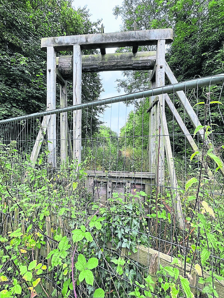 Hadley Park Lock guillotine lock gate, partially restored but very overgrown, on the Trench Arm of the Shrewsbury and Newport canal, where Usk skipper George Benbow was killed. PHOTO: COURTESY MIKE WEBB & PEARSON’S CANAL COMPANIONS