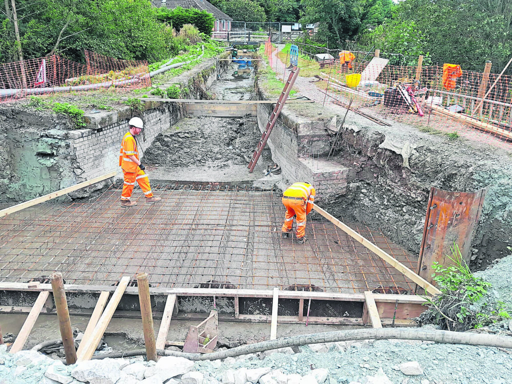 Workers completing essential restoration work to the Aberbechan Aqueduct at Refail, near Berriew, as part of the wider project to reopen the Montgomery Canal. PHOTO: SUPPLIED