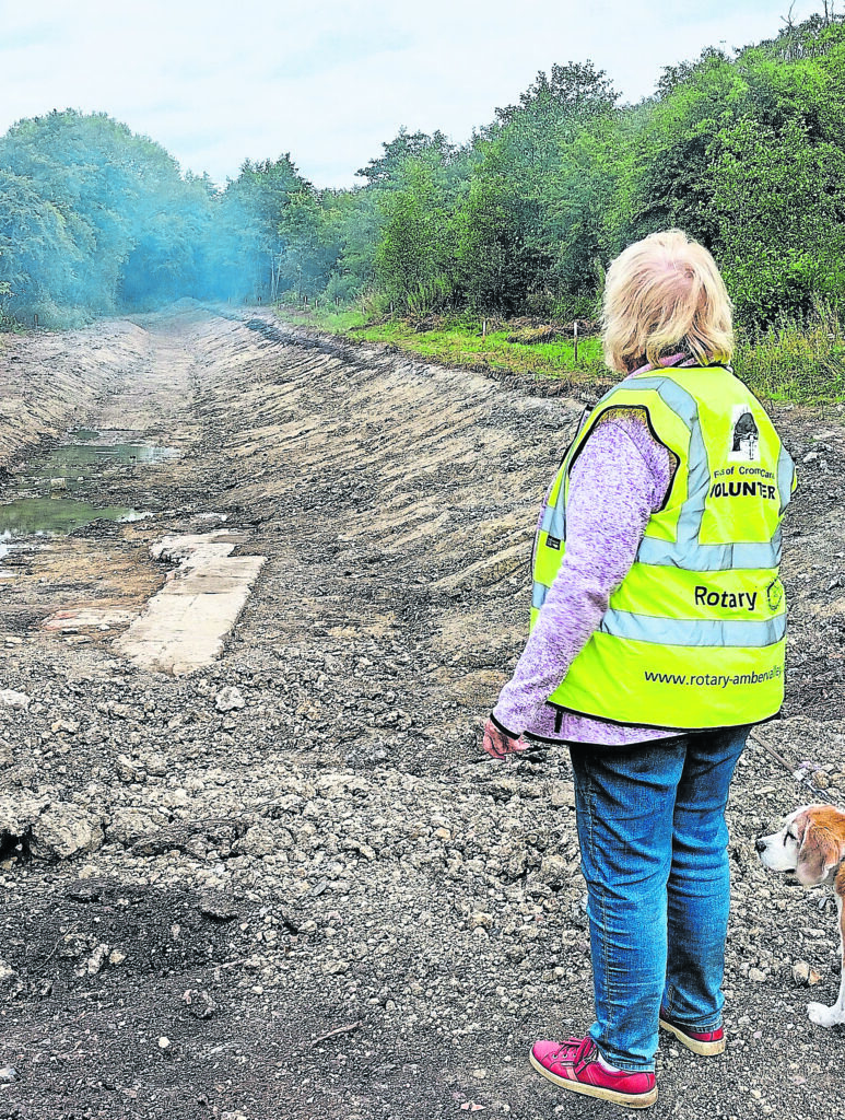 A visitor views the flood plain extension profiled and showing the remains of the original Cromford Canal lock (Marshalls Lock). PHOTO: SUPPLIED