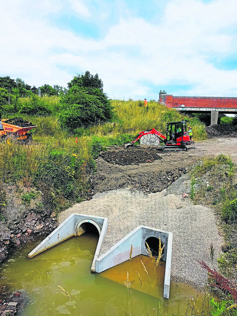 Volunteers from the Waterway Recovery Group and Friends of Cromford Canal have completed more work at Beggarlee, Langley Mill, Derbyshire as part of canal restoration work. Diggers move soil around the flood channel. PHOTO: SUPPLIED