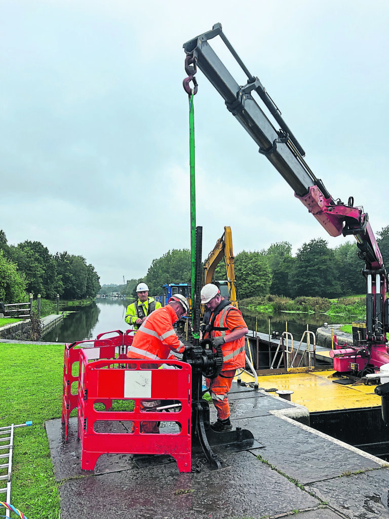 Engineers used a crane boat to repair Hunts Lock. PHOTO:SUPPLIED