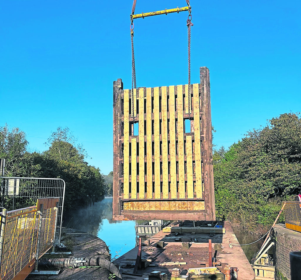 The lock gate is lifted at Holt Lock.