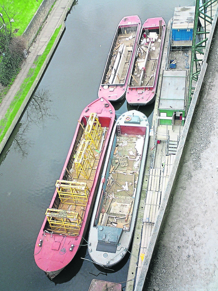 WHH barges moored at the McAlpine construction site at Kings Place, King’s Cross, beside the Regent’s Canal.