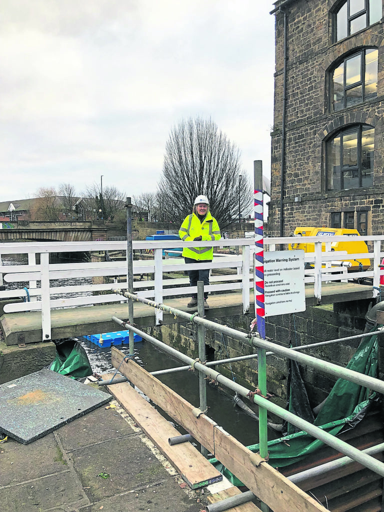 Ruth Garratt, heritage adviser for the Canal & River Trust, overlooks the repair work at Leeds River Lock 1.