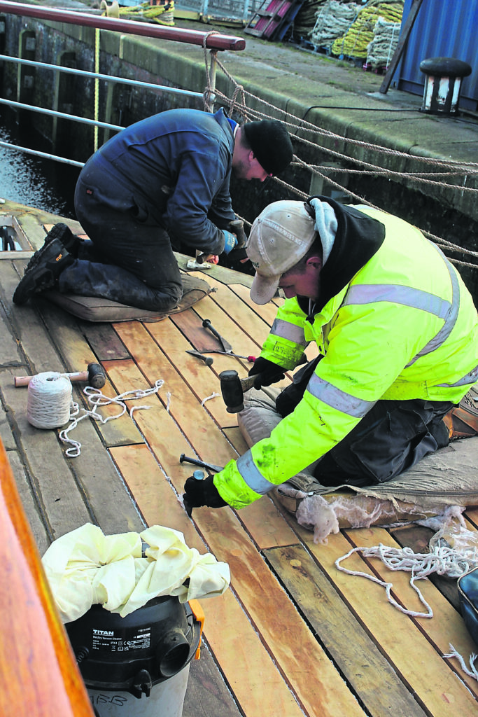 Traditional skills, provided by staff from Kerr’s Boatyard of Arbroath, are used to replace deck timbers. PHOTO: HUGH DOUGHERTY