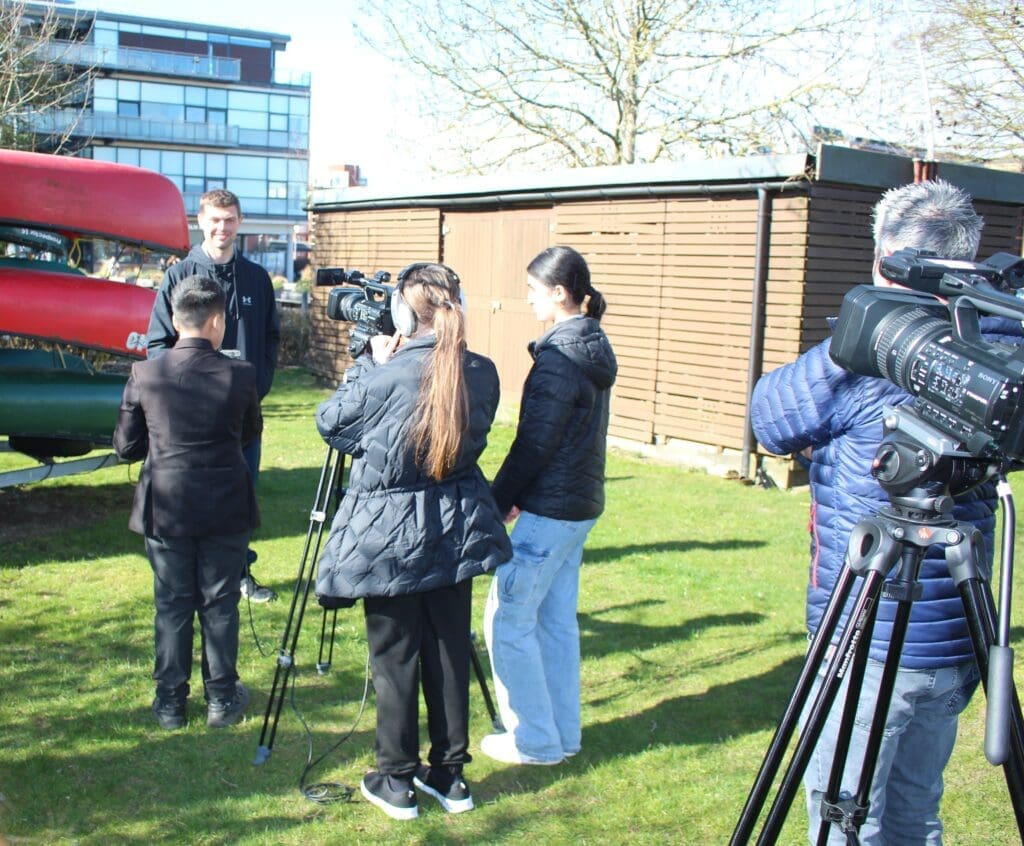 School students interviewing Jack Mooney, vice president of the University of Lincoln Rowing Club, which has been unable to train because of flooding on the city’s rivers in recent months. Photos by Callum Evans.