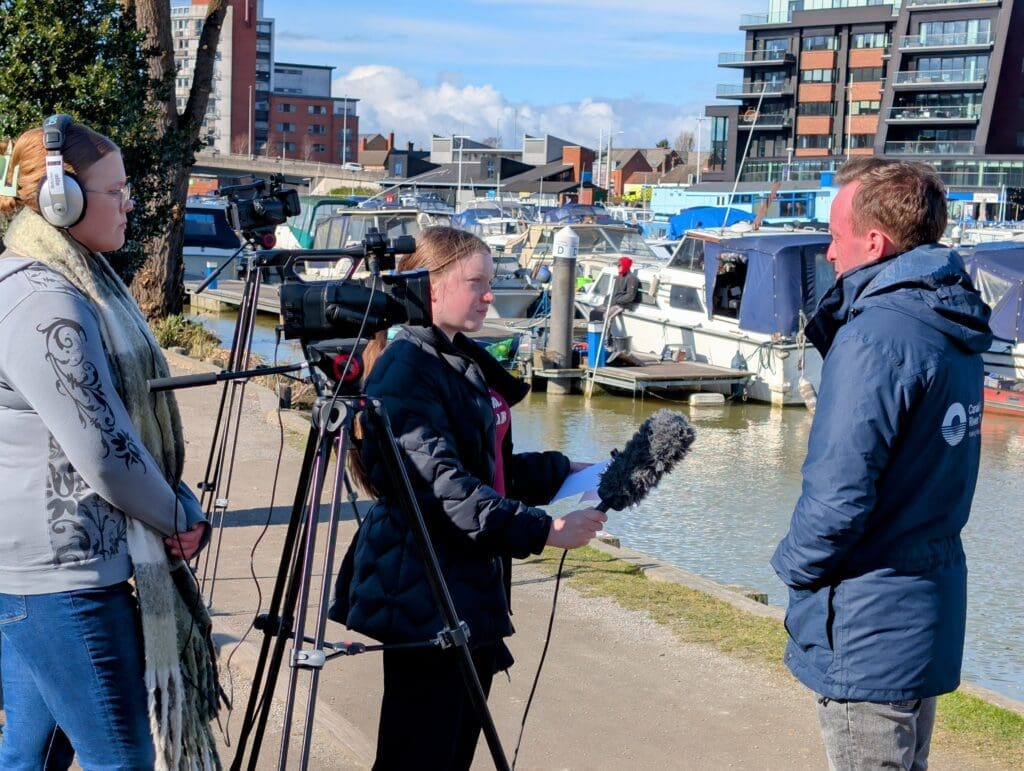 School students interviewing Stephen Hardy, communications manager with the Canal & River Trust. The trust has called for more volunteers to assist with cleaning up after flooding incidents. Photos by Callum Evans.