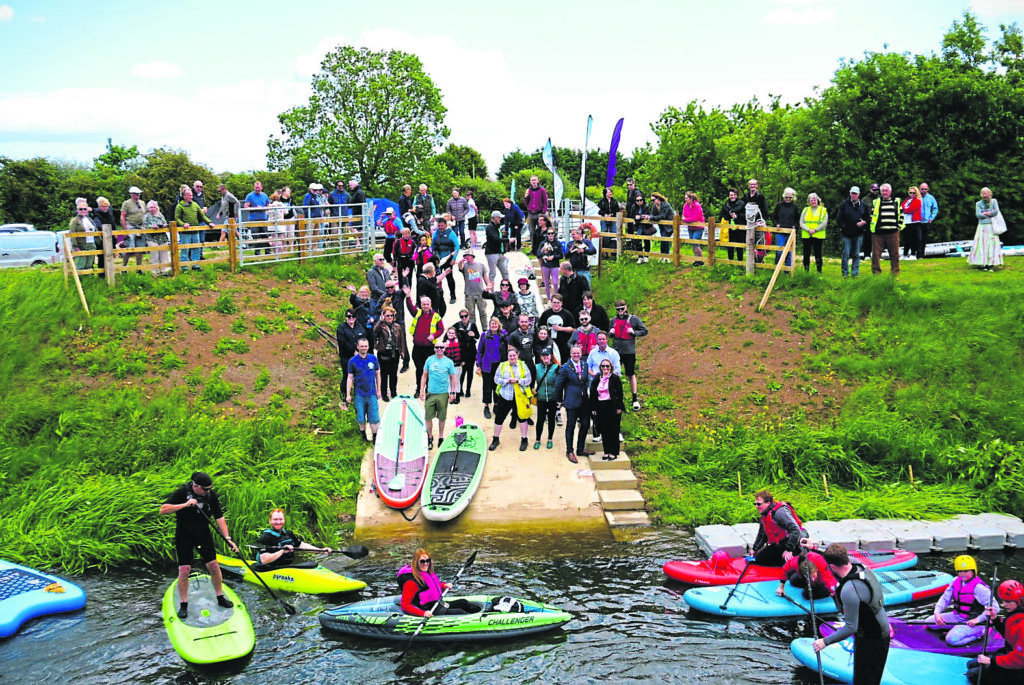 Supporters gather on water and land at the official launch of the Austen Fen slipway. PHOTO: ASHLEY BEAVIS