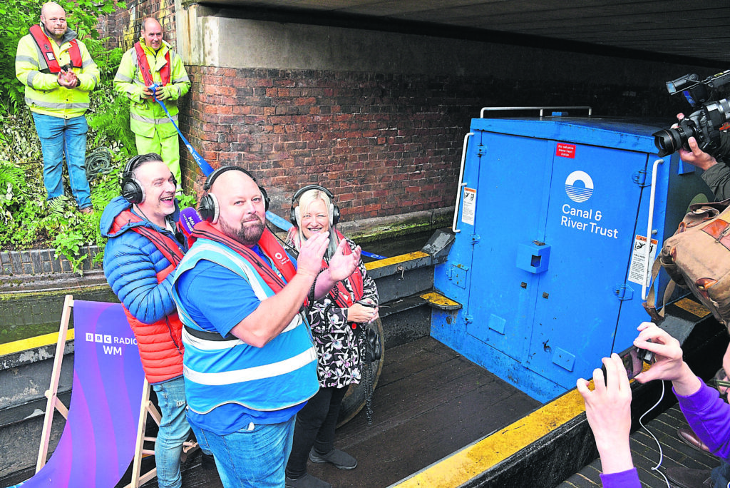 Lee Bates, area operations manager at the Canal & River Trust, Ed James, from BBC Radio WM and Walsall Town Mayor Coun Louise Harrison cut the ribbon to officially reopen the canal. PHOTO: CRT