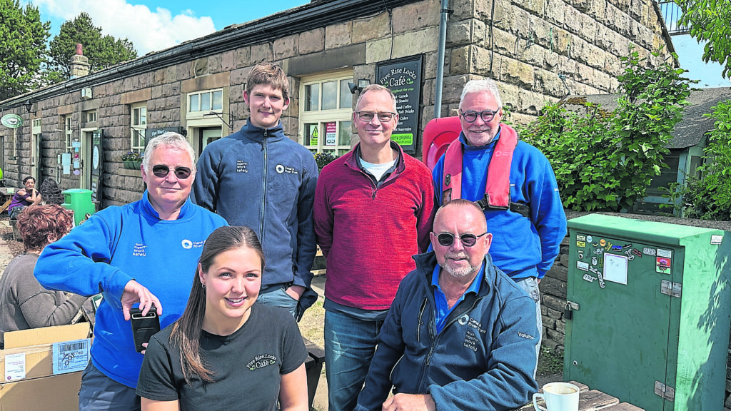 From left: Phillippa Gibbons, Canal & River Trust volunteer lock keeper; Megan Darley, Bingley Five Rise Locks Cafe; Seth Anderton, Canal & River Trust seasonal lock keeper; Joost Smeele; Stephen Pierce, Canal & River Trust volunteer lock keeper (wearing life jacket) and Richard Breese, Canal & River Trust volunteer lock keeper. PHOTO: SUPPLIED