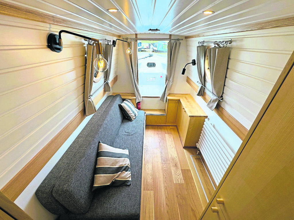 The bedroom with the bed folded to make a couch. PHOTO: PHIL PICKIN