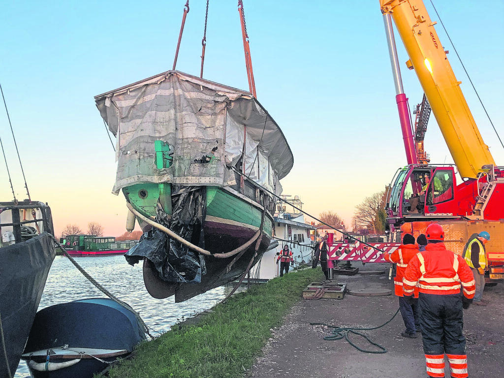 White Heather being raised from the dock. PHOTO: CRT