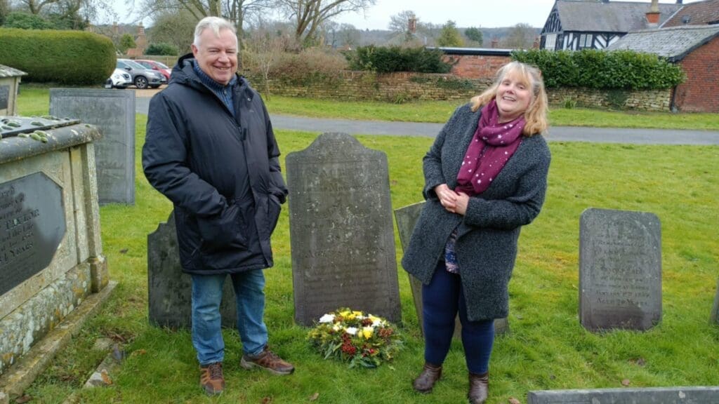 Harlaxton History Society members Steve Parkes and Kim Ridgeway lay a wreath at the grave of Nicholas Harby.